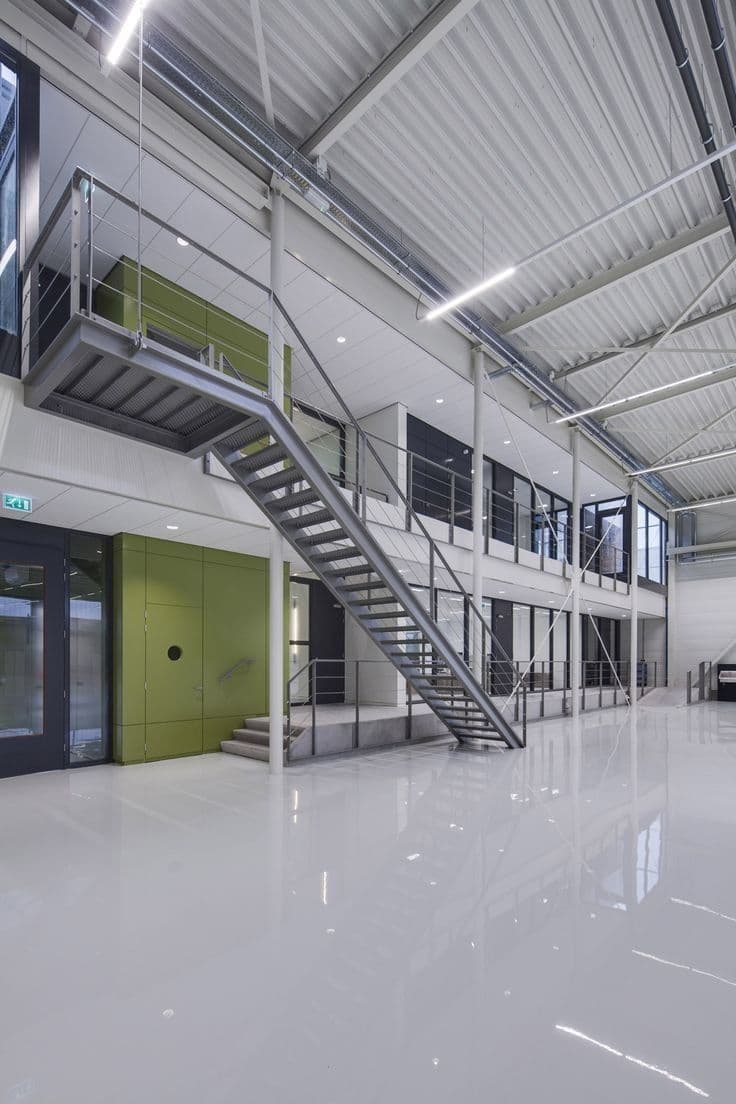 White epoxy flooring in modern commercial space with mezzanine