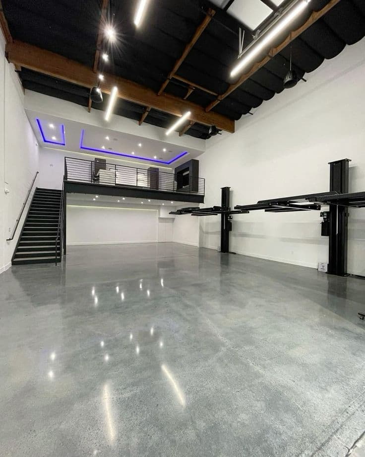 Polished epoxy floor in automotive workshop